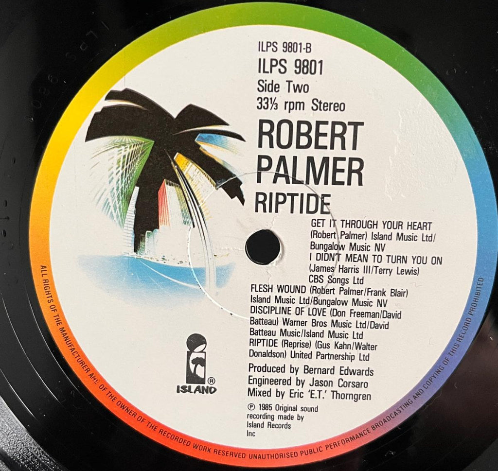 Robert Palmer's Riptide - Side 2 Label is the 1980s UK Island with a 'Palm Tree' image and a rainbow rim.