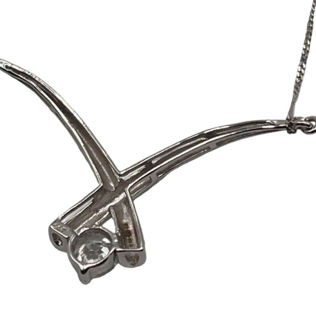 Silver necklace with a unique pendant design on a white background