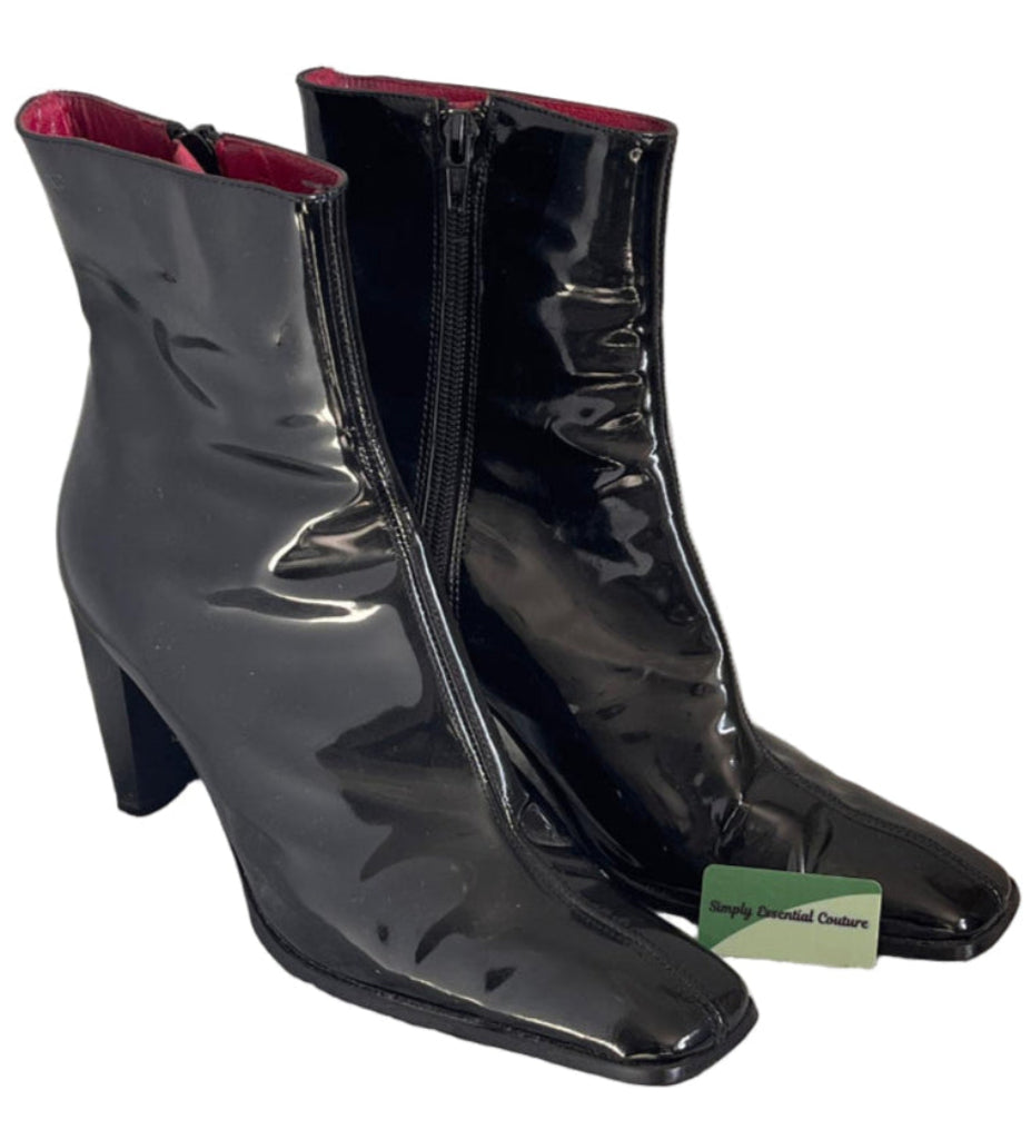 Black iBLUES patent leather boots with a visible brand tag on a white background