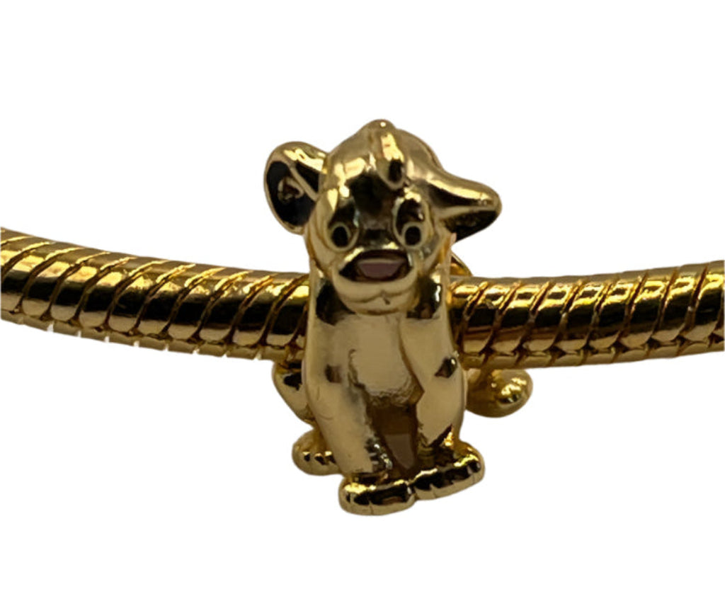 Gold Disney Simba The Lion King charm on a white background