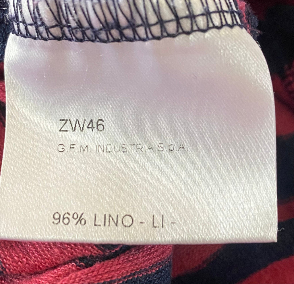 Fabric label with text and a plaid pattern in the background