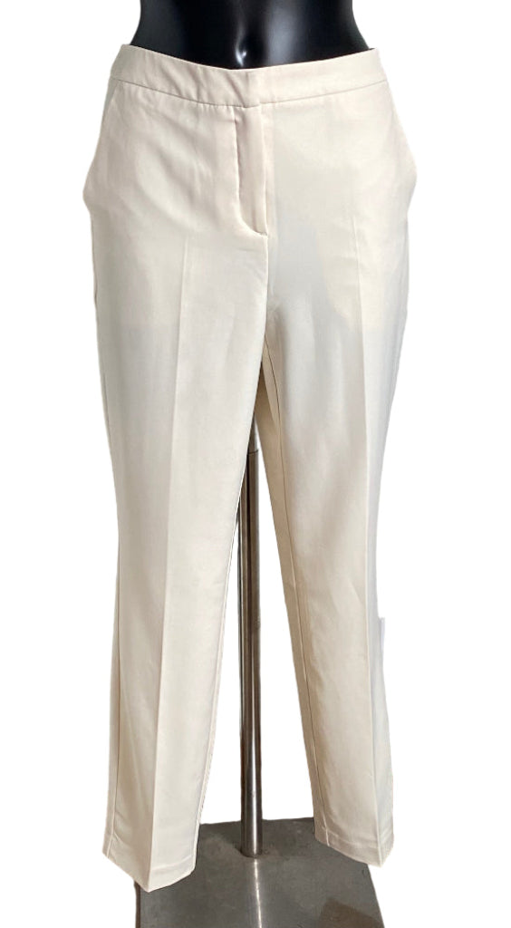 Cream Trousers on a mannequin against a white background