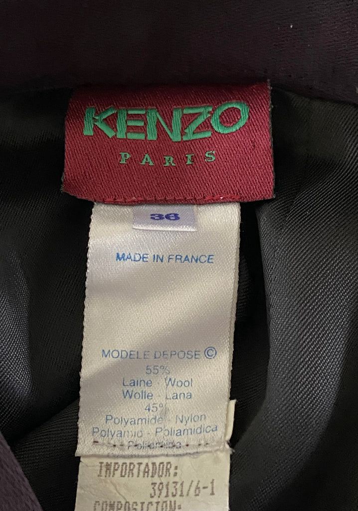 Kenzo Paris label on a garment with size tag and material information.