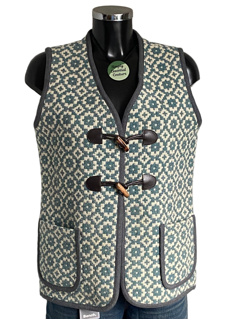 TREFRIW Patterned vest on a mannequin with visible brand label against a white background