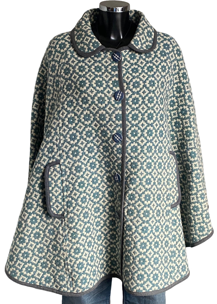 TREFRIW Patterned cqpe on a mannequin against a white background