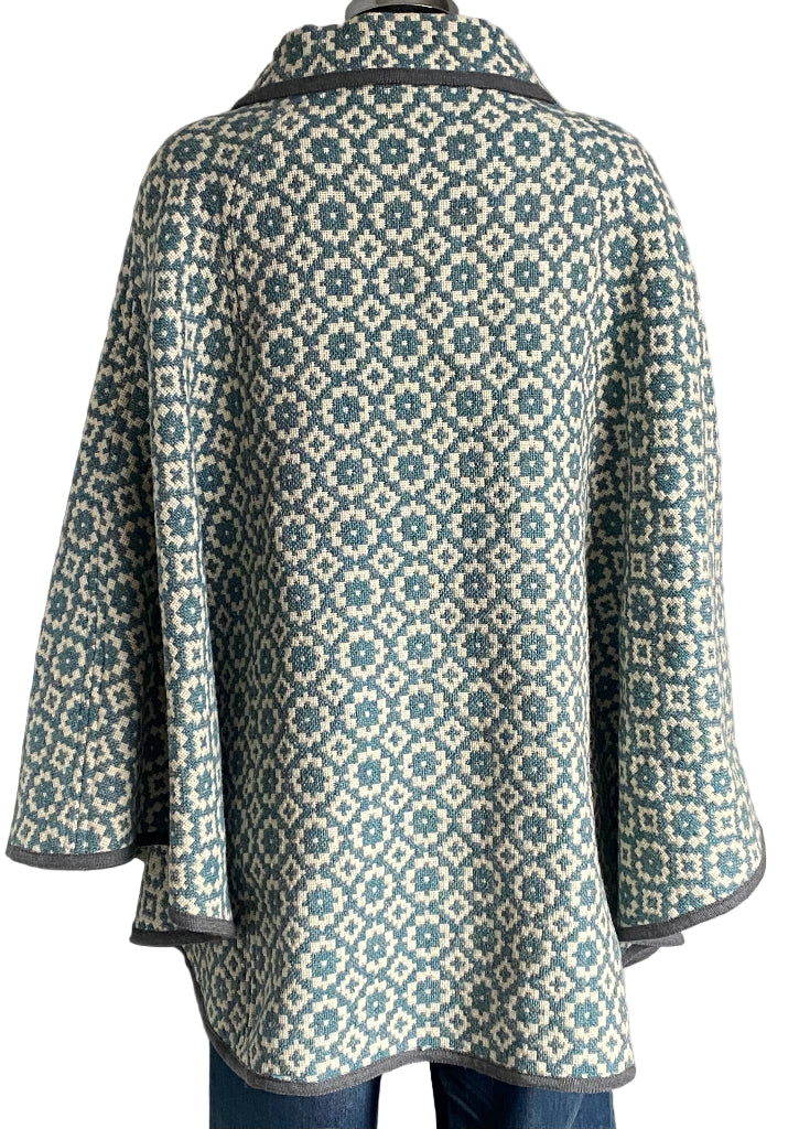 TREFRIW Patterned cape on a white background