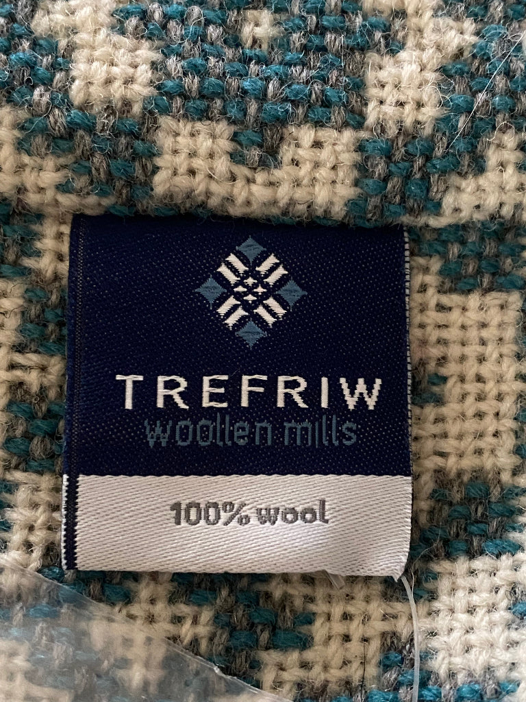 Trefriw woolen mills label on a woven fabric background