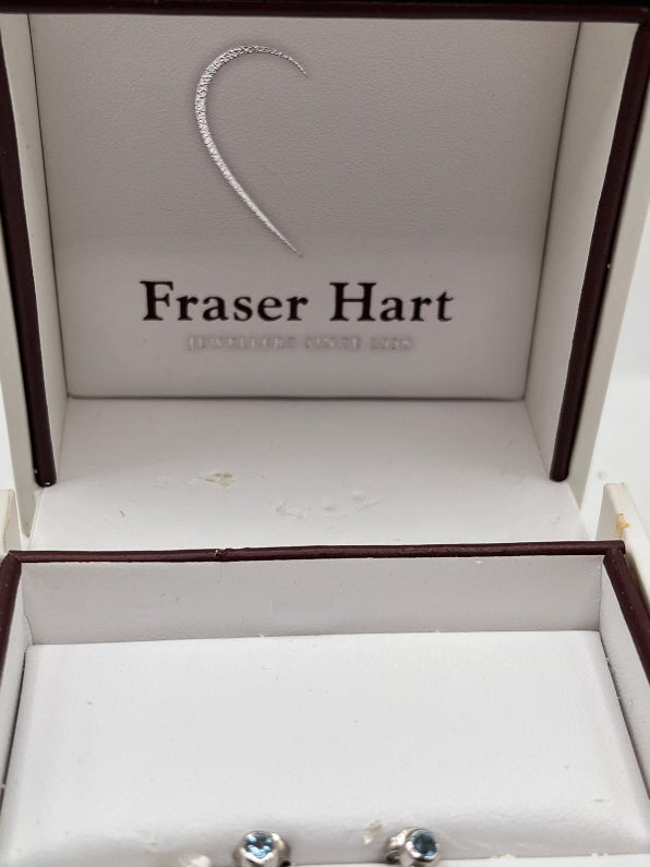 Jewelry box with Fraser Hart branding and a heart-shaped earring.