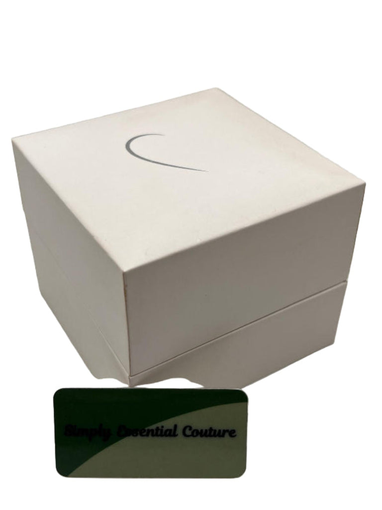 White jewelry box with a card labeled 'Simply Essential Couture' on a white background