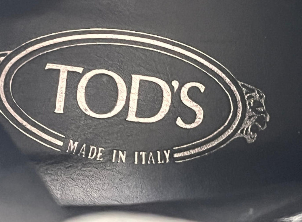 Close-up of a TOD'S logo inside the boot