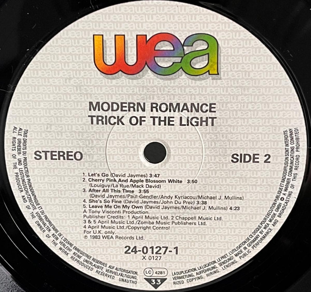 Record label with 'WEA' branding and track listing on a vinyl record