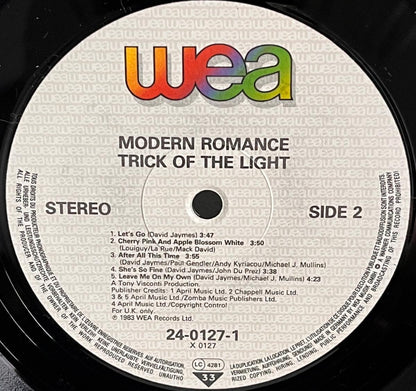 Record label with 'WEA' branding and track listing on a vinyl record