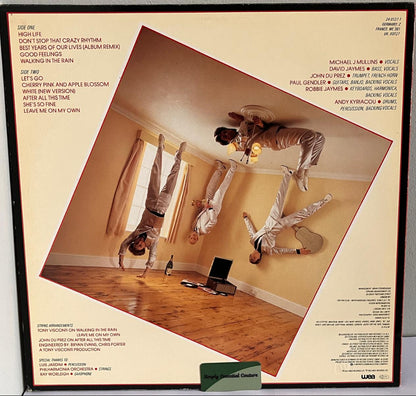 Modern Romance Vinyl - Vinyl record cover with a person doing handstands on a wooden floor.