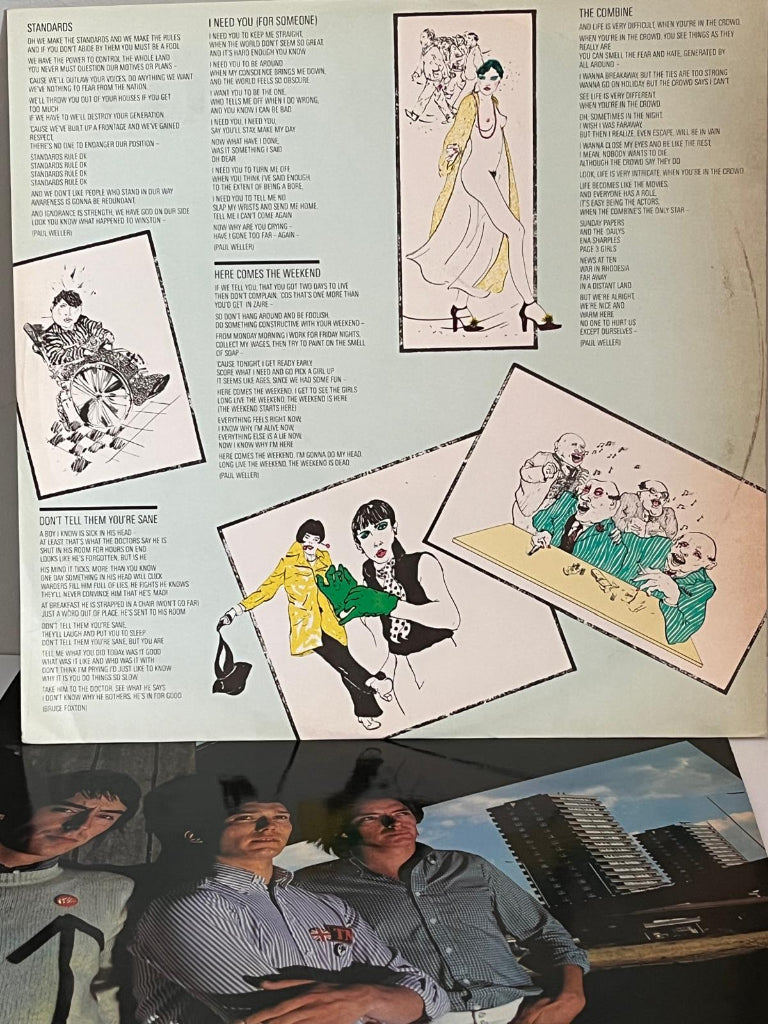 Vinyl record cover for 'This is the Modern World' by The Jam with inner sleeve ;yric sheet