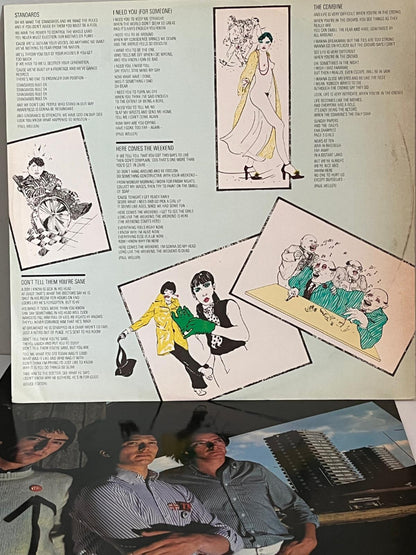 Vinyl record cover for 'This is the Modern World' by The Jam with inner sleeve ;yric sheet