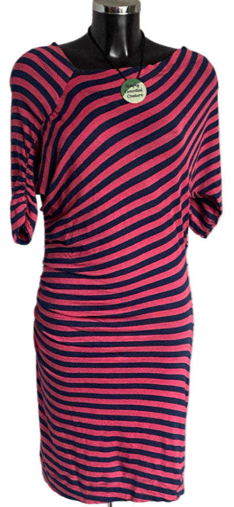 Red and navy striped dress on a mannequin with a white background