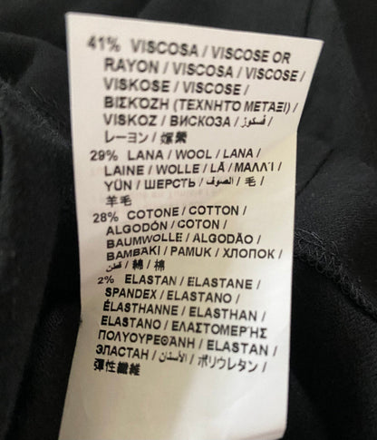 Clothing label with fabric composition details on a black background