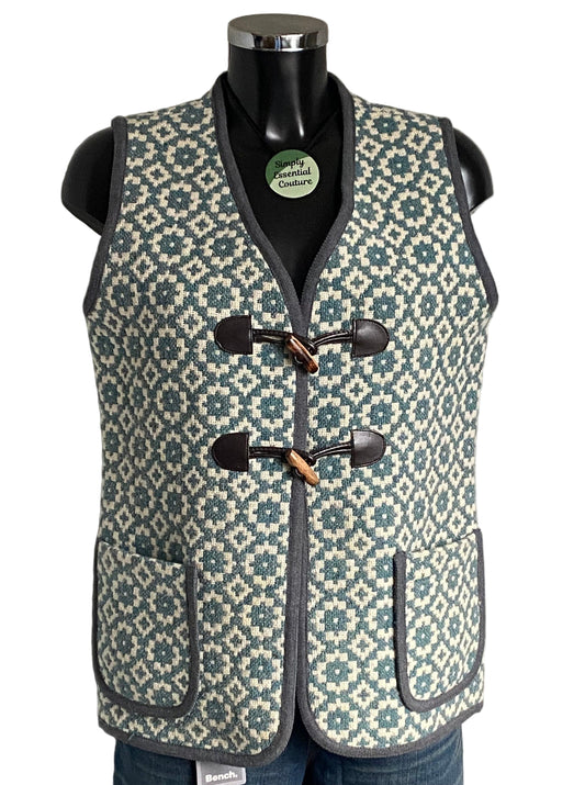 TREFRIW Patterned vest on a mannequin with visible brand label against a white background