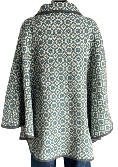 TREFRIW Patterned cape on a white background