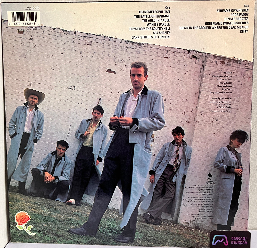 Vinyl record cover with The Pogues in front of a brick wall.