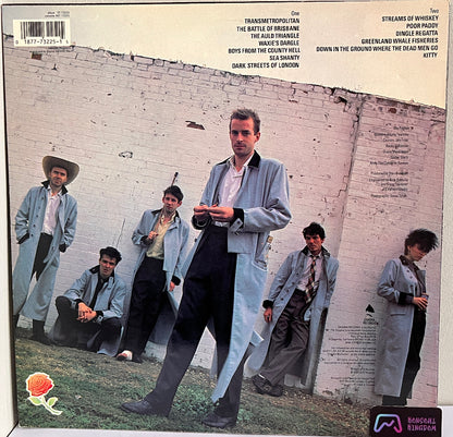 Vinyl record cover with The Pogues in front of a brick wall.