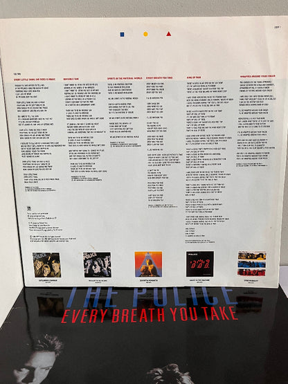 Back cover of vinyl record with tracklist and album cover images, featuring 'The Police' and 'Every Breath You Take'.