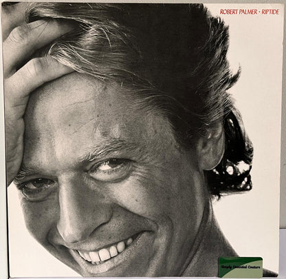 Album cover for 'Riptide' with a black and white photo of 'Robert Palmer
