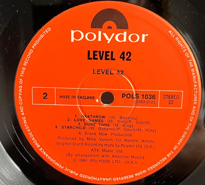 Vinyl record label with Polydor branding and 'Level 42' album details.
