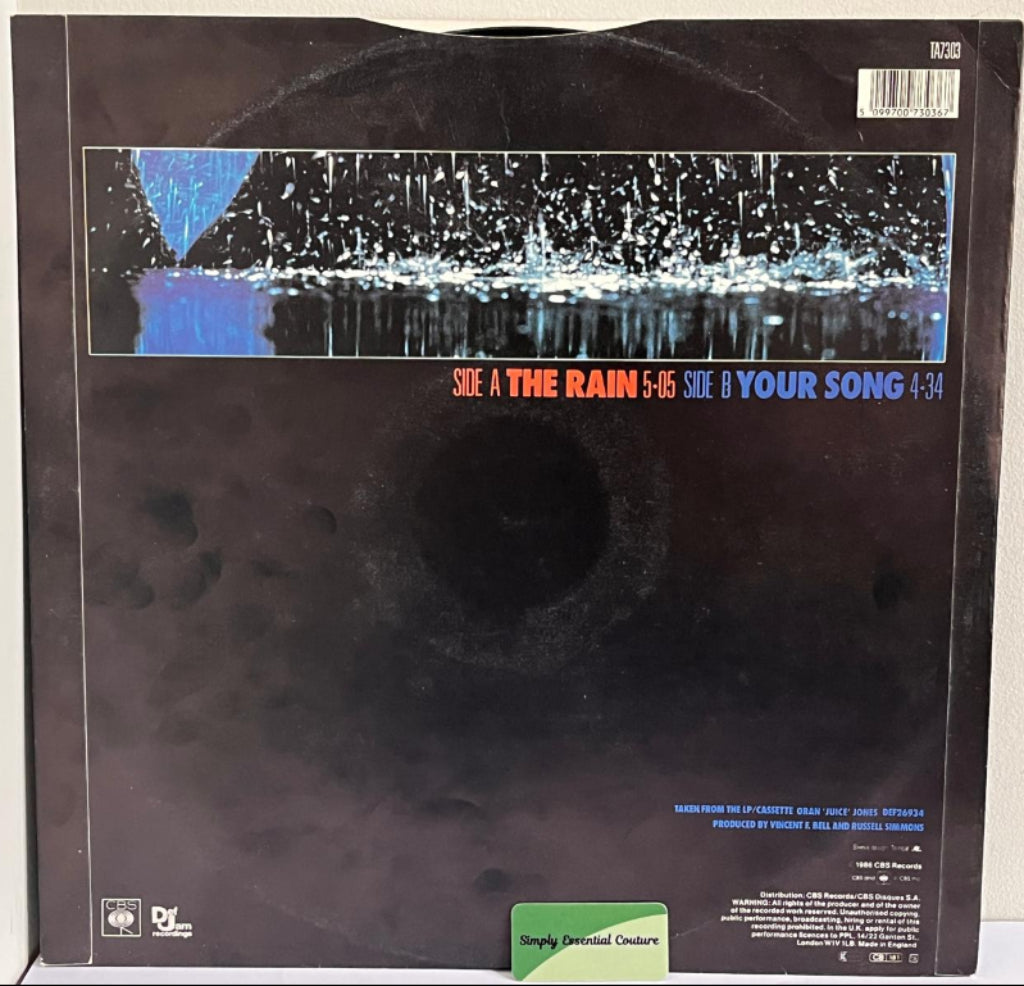 Vinyl record with a black cover featuring text and a graphic design.