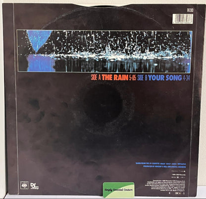 Vinyl record with a black cover featuring text and a graphic design.