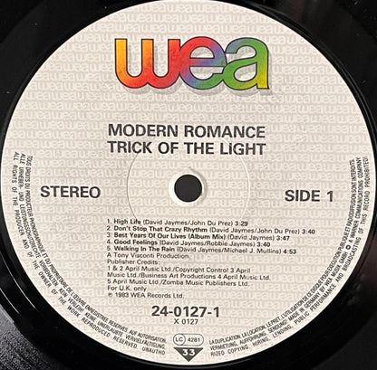 Record label for 'Modern Romance' by Trick of the Light with WEA branding.
