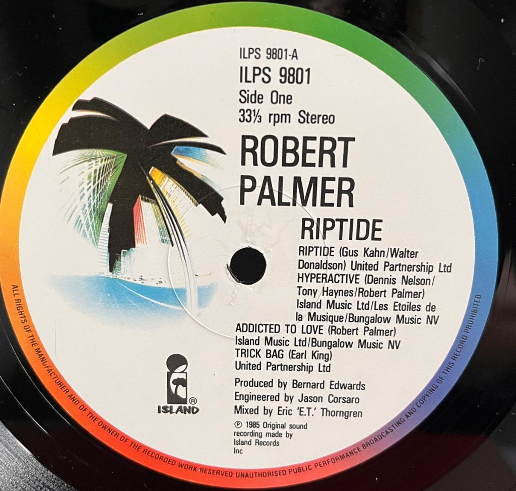 Robert Palmer's Riptide - Side 2 Label is the 1980s UK Island with a 'Palm Tree' image and a rainbow rim.